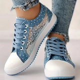 Caro – Elegantne naiste sneaker lilledega detailidega