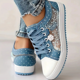 Caro – Elegantne naiste sneaker lilledega detailidega