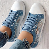 Caro – Elegantne naiste sneaker lilledega detailidega