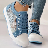Caro – Elegantne naiste sneaker lilledega detailidega