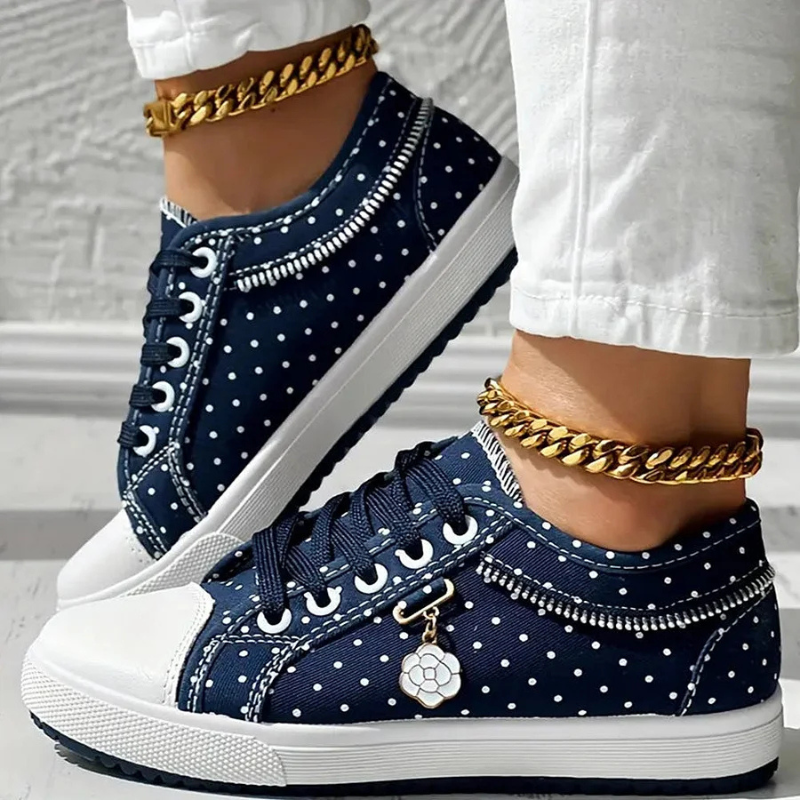 Caro – Elegantne naiste sneaker lilledega detailidega
