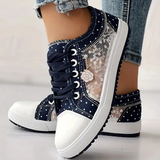 Caro – Elegantne naiste sneaker lilledega detailidega