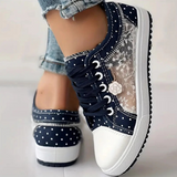 Caro – Elegantne naiste sneaker lilledega detailidega