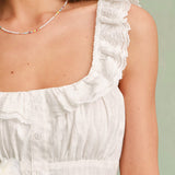 Valge Ruudukujuline – Elegantne ruffle top